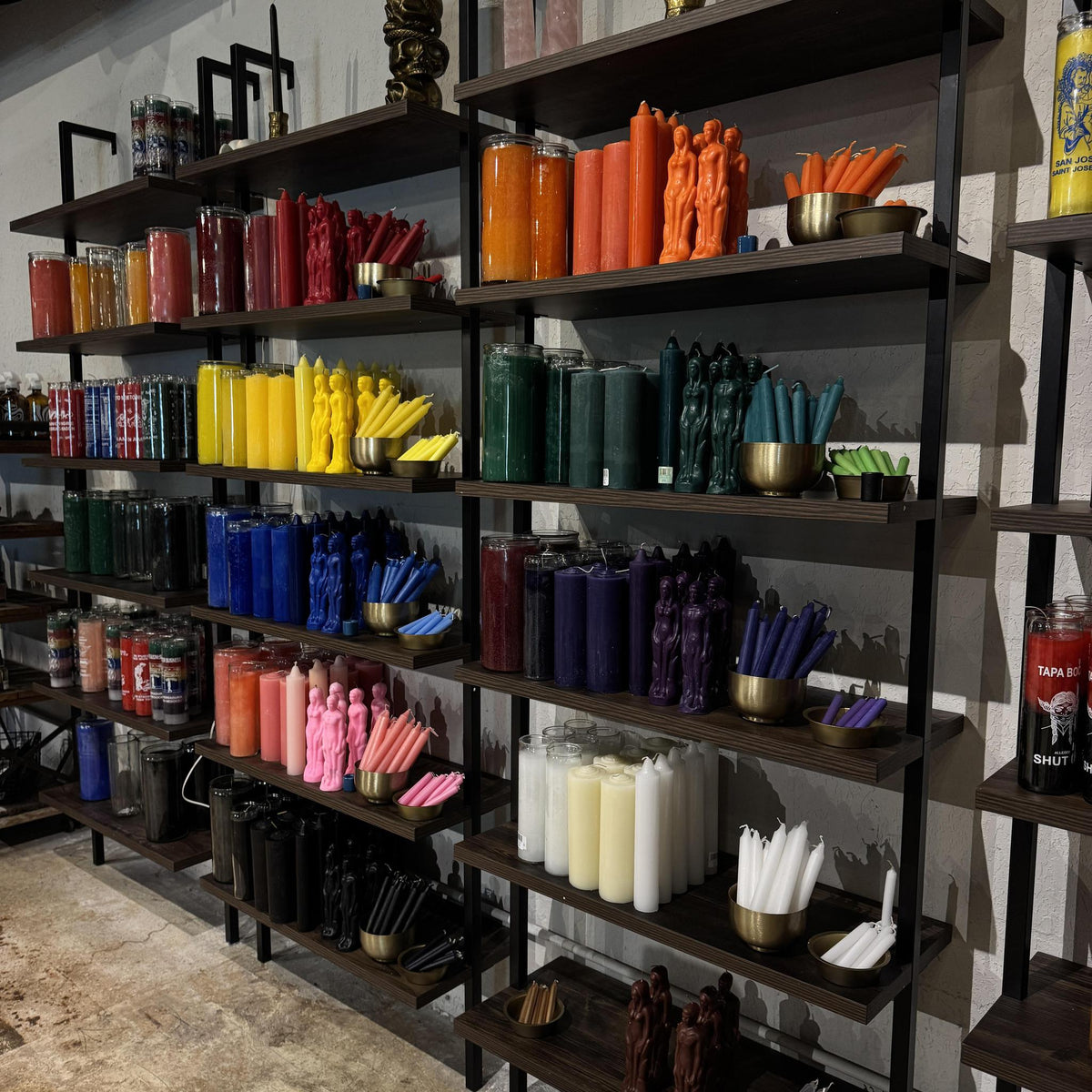 Shelves filled with Spellcrafter’s colorful spell, pillar, taper, and human figure candles inspire your next ritual. Join "The Power of Candle Magic Workshop" on January 22nd at 6:30 PM to learn more!.