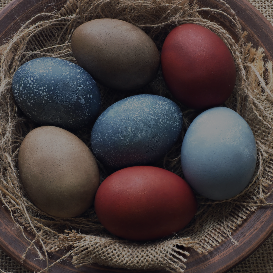 Celebrate the spring equinox with Spellcrafter’s Ostara Ritual on March 22nd, 5 PM—a rustic bowl of dyed eggs in blue, red, and brown sets a festive mood for this special event by Spellcrafter.