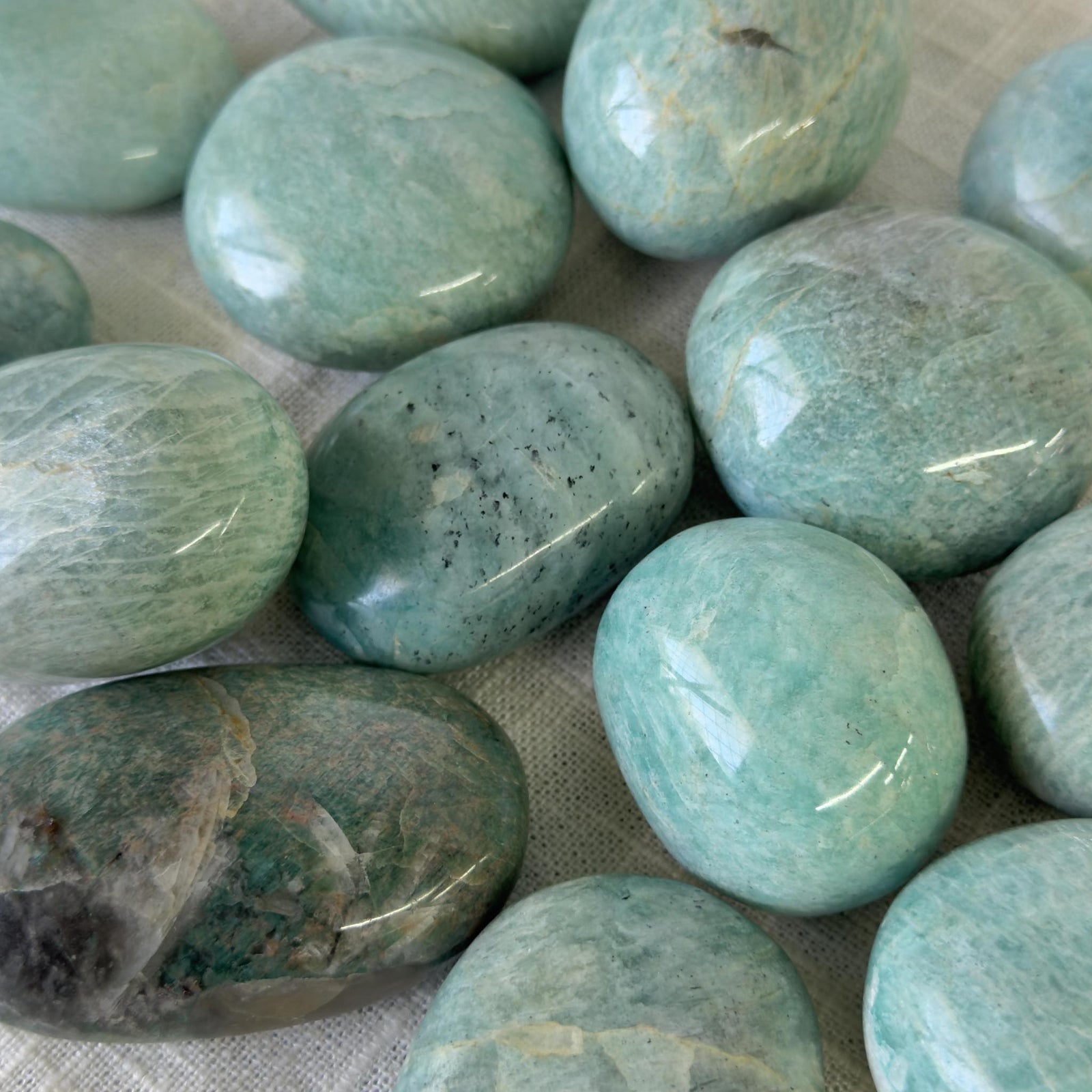 Spellcrafter’s Amazonite Palm Stones, renowned for their healing properties, showcase soothing blue-green hues and...